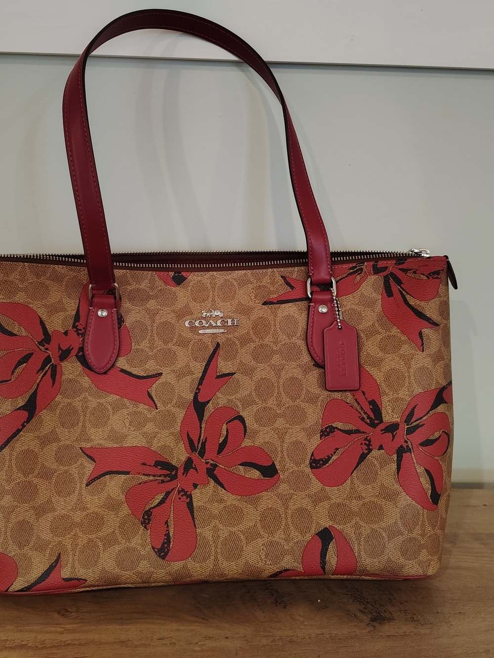 Coach Brown Signature Tote with Pink Bow Accents
